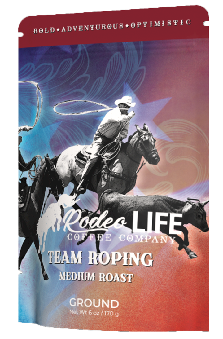 Team roping duo chasing steer in synchronized action at rodeo event