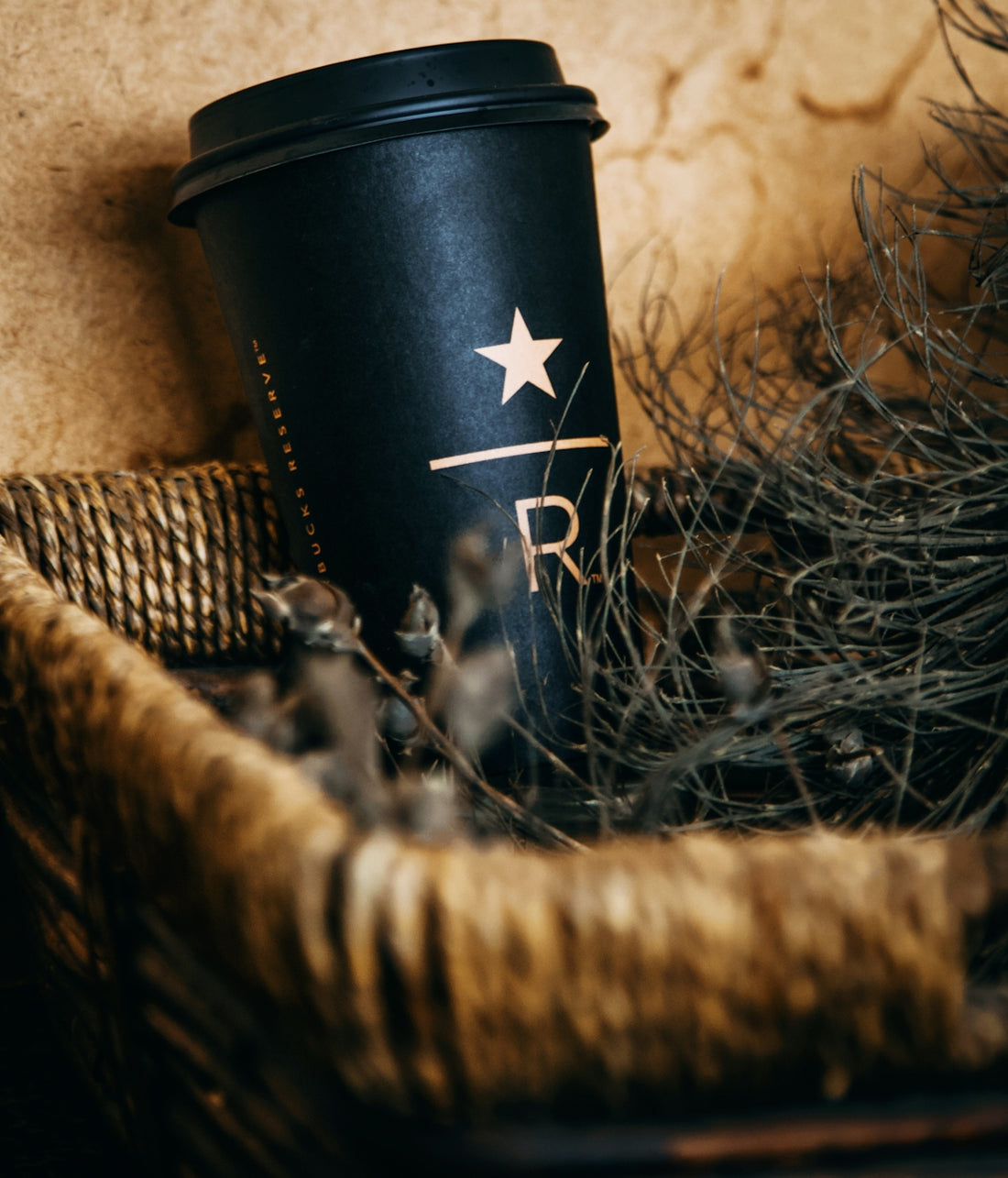 black and silver cylindrical container on brown woven basket