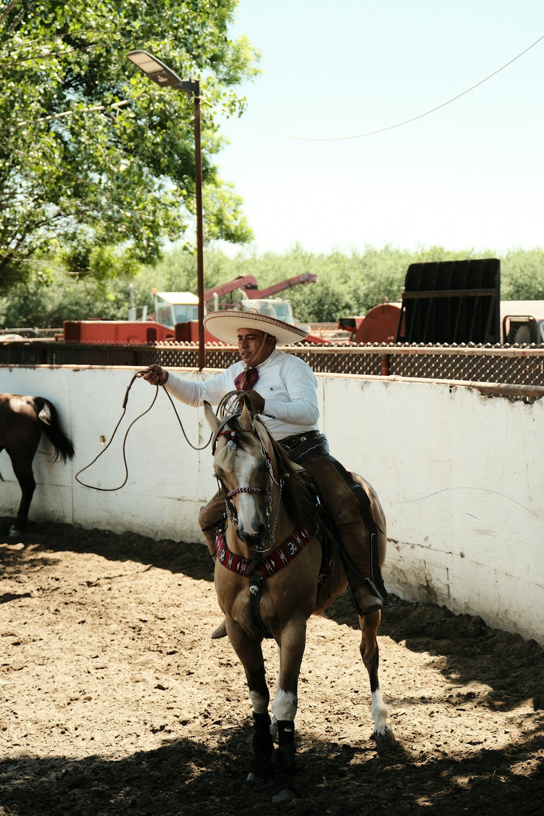 a man in a cowboy hat riding a horse