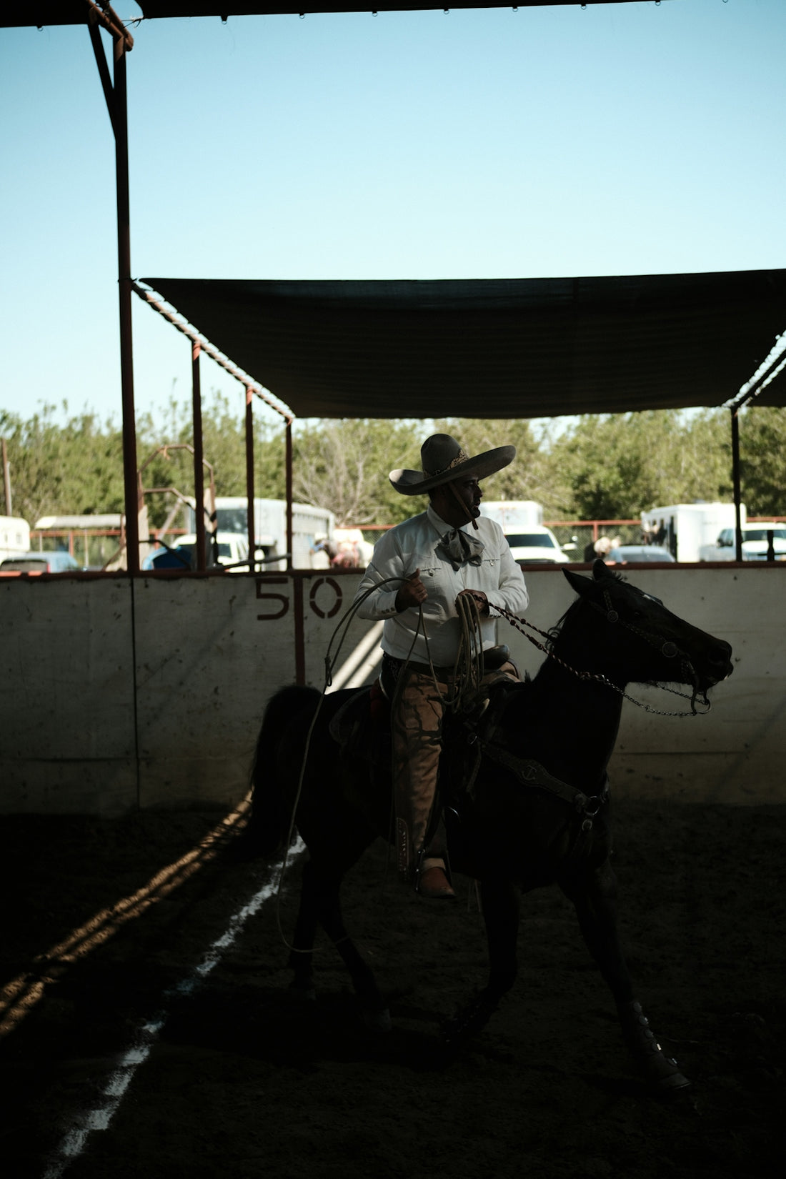 a man riding on the back of a black horse